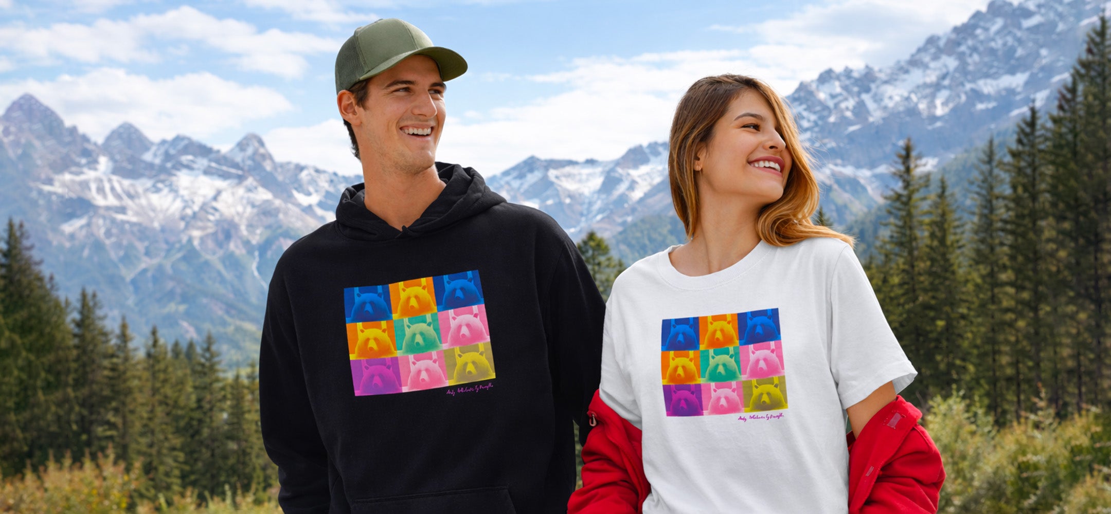 Collection Pop Art Pyrénées Kiwa portée par un homme en hoodie noir et une femme en t-shirt blanc